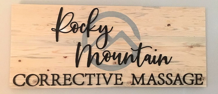 The hand-lettered Rocky Mountain Corrective Massage studio sign