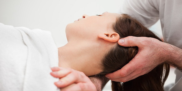 Gentle head and neck release during a relaxation massage